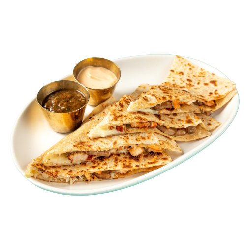 house quesadilla with achiote chicken and queso Oaxaca